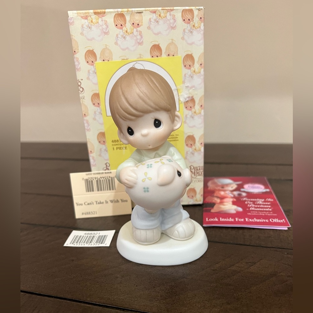 Precious Moment- You can’t take it with you 1988 in box.
